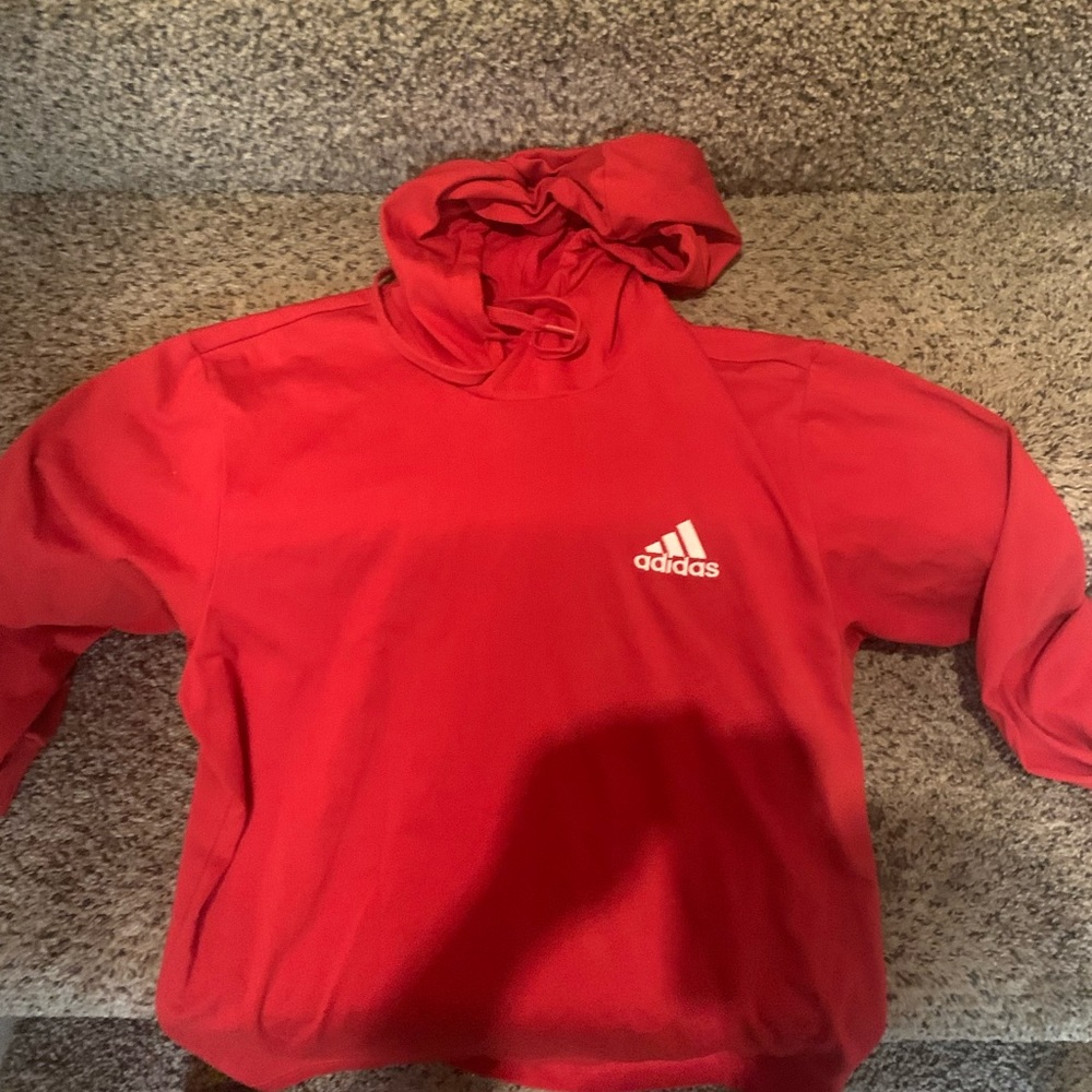 New red adidas hoodie .